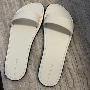 The Row white leather beach slides